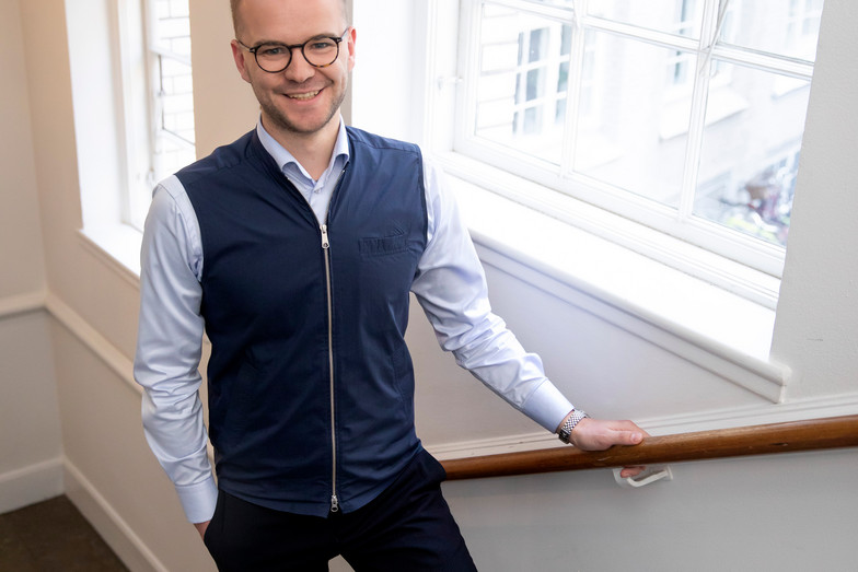 Morten Lundby Pedersen walking up the stairs